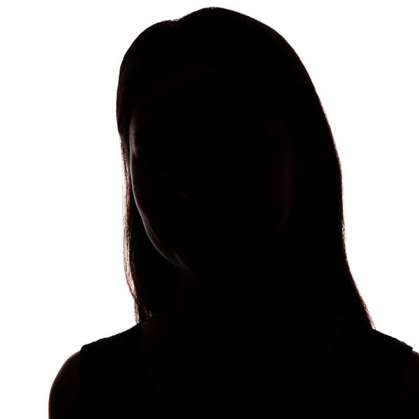 A close-up photograph showing the silhouette of a young woman.